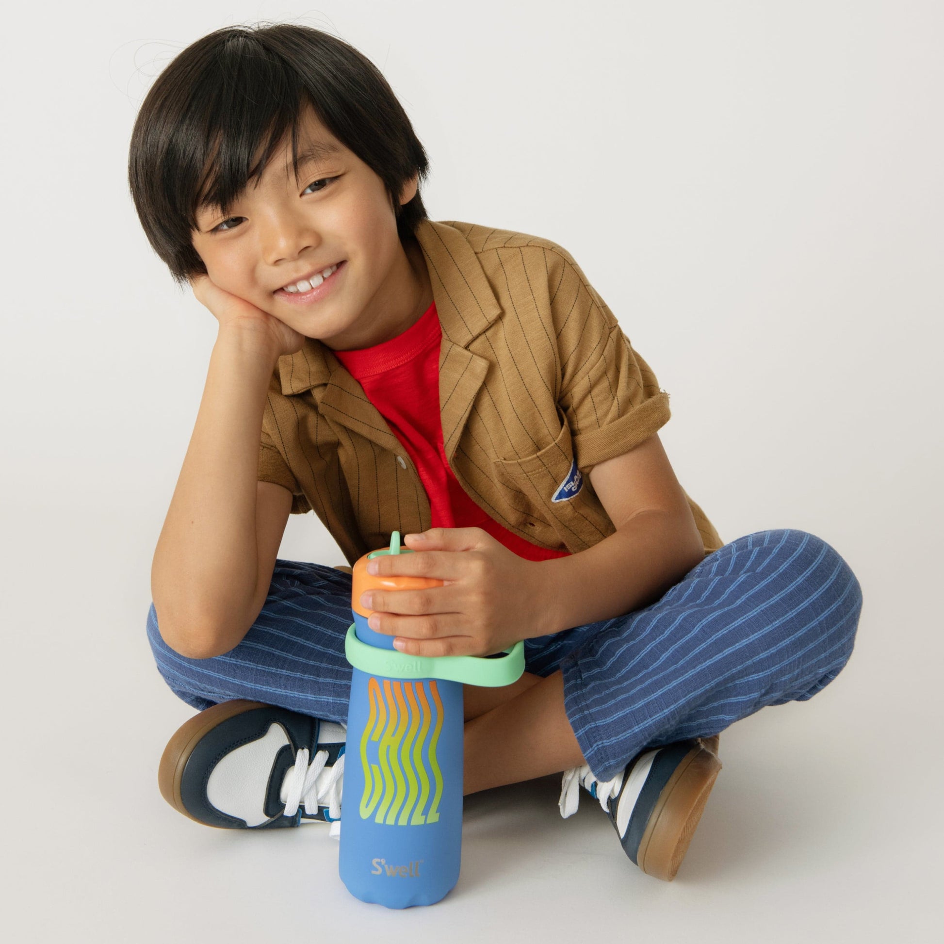 traveler-with-flip-straw-lid-16oz-h8 Swell-Kids-Water-Bottle-Traveler-16oz-Blue-Chill-Lifestyle.jpg